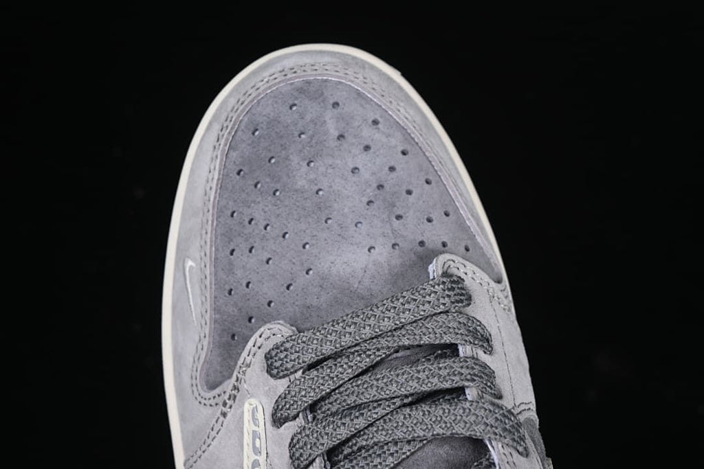Top view of perforated gray toe box and laces
