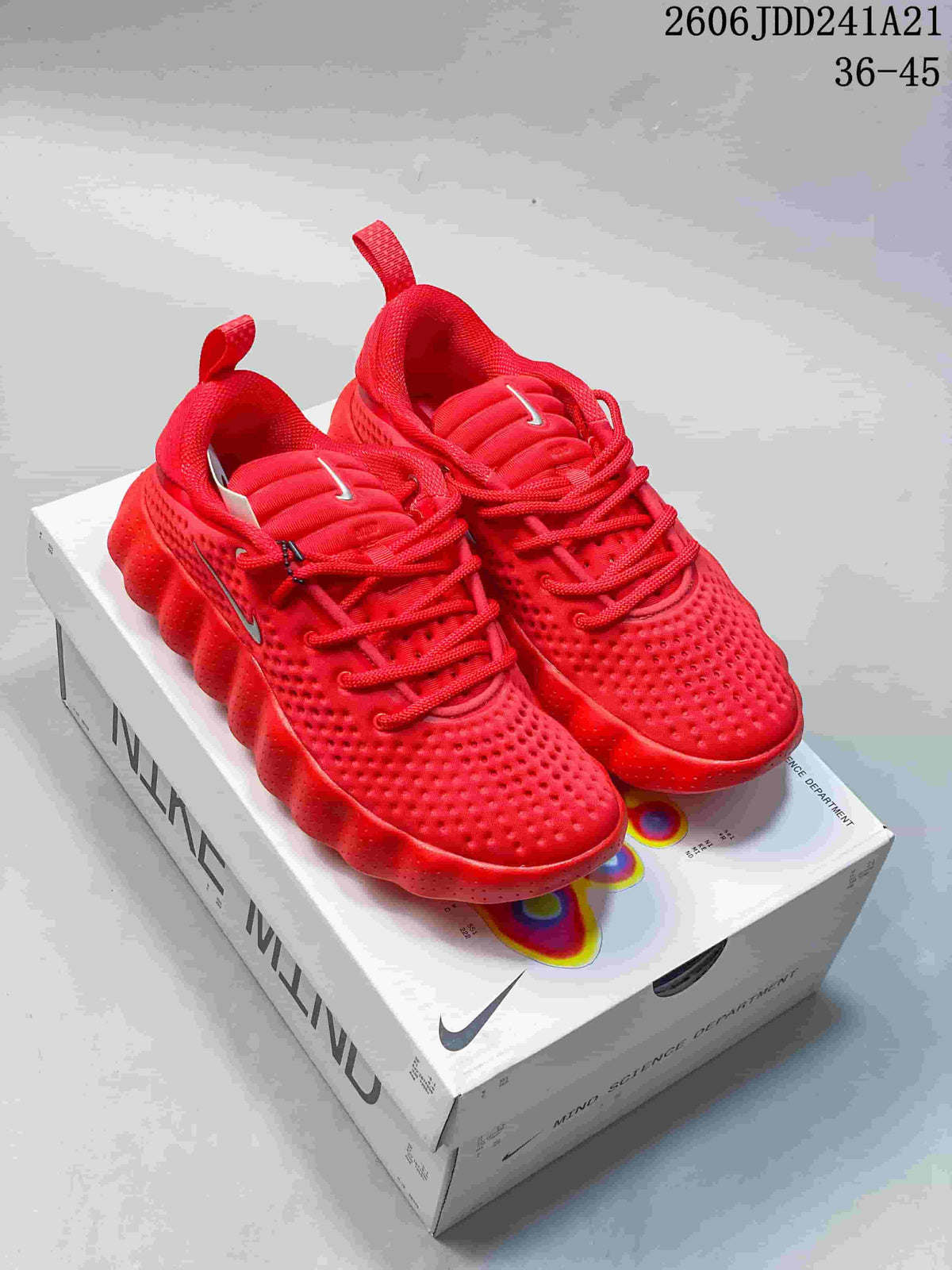 Red Nike Mind low-top shoes displayed on a Nike Mind box