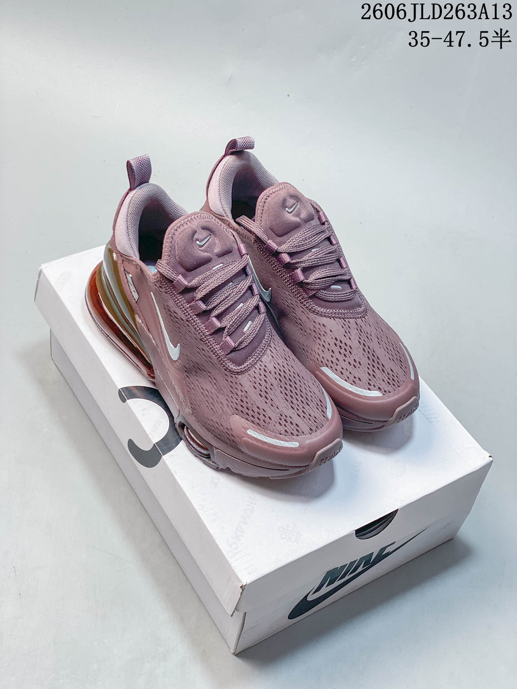 Dusty pink Nike Air Max 270 sneakers shown on a shoebox