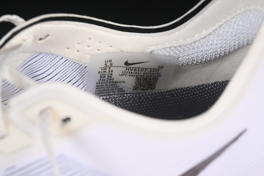 Close-up of the shoe's interior size label showing EU 38 and style code HV6107-100