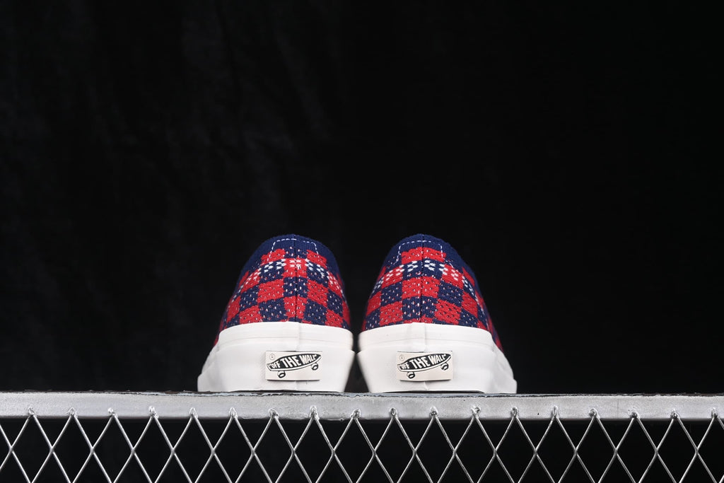 Rear view of the pair showing the check-pattern heel panels and Vans heel details.