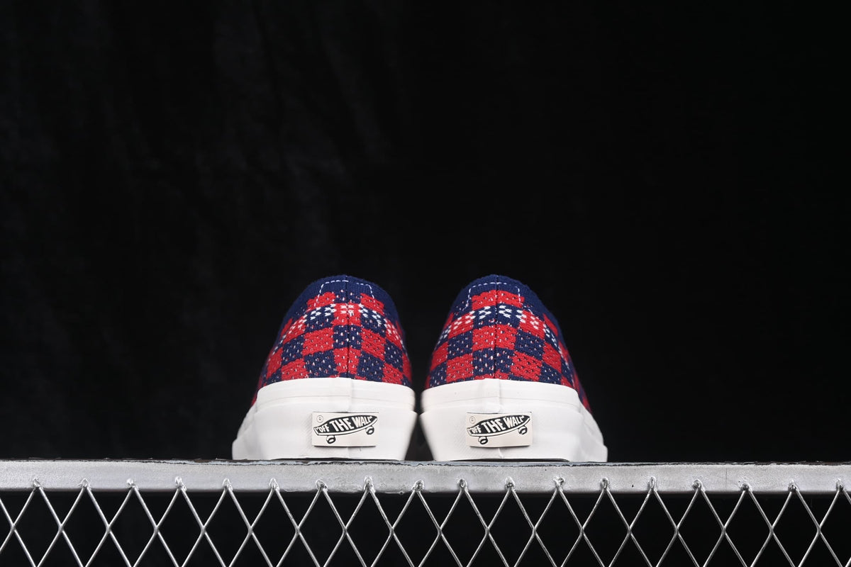 Rear view of the pair showing the check-pattern heel panels and Vans heel details.