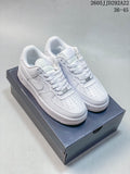 Pair of white Nike low-top sneakers displayed on a shoebox