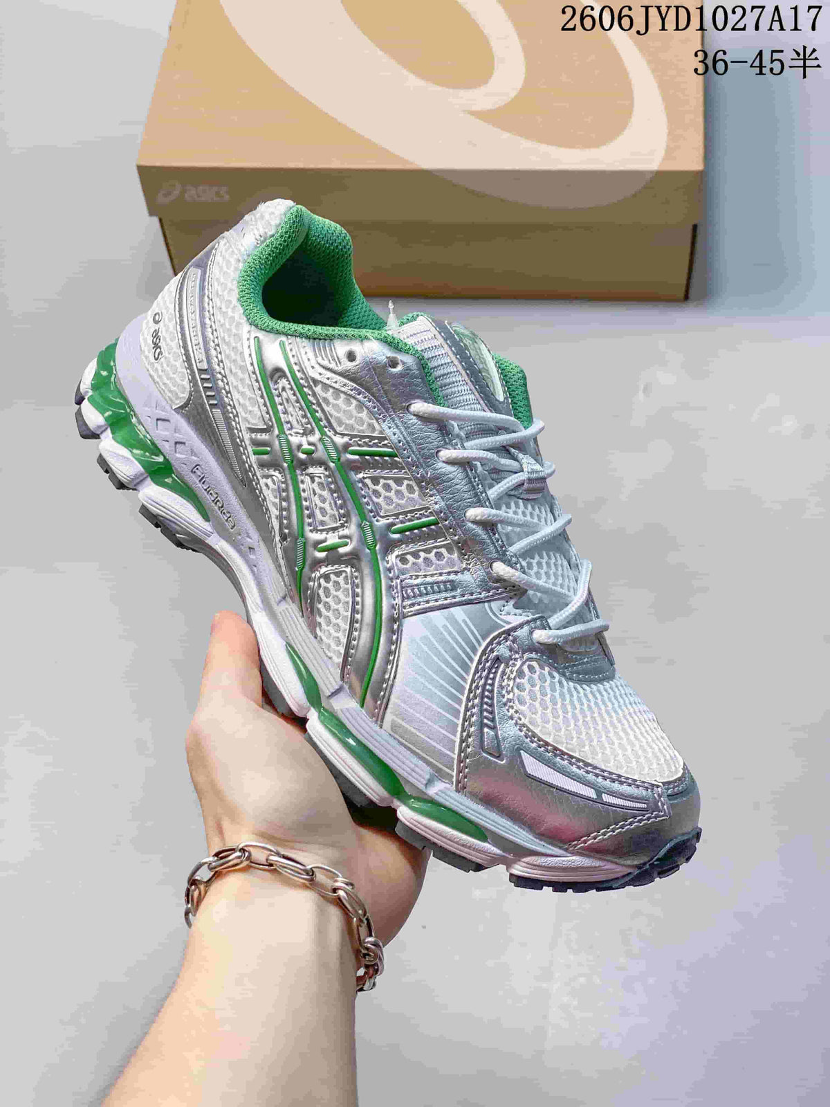 White and silver ASICS GEL-KAYANO 12.1 sneaker with blue accents