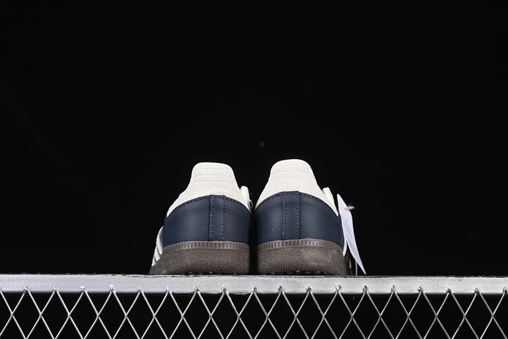 Rear view of the pair showing cream heel tabs and navy heel panels
