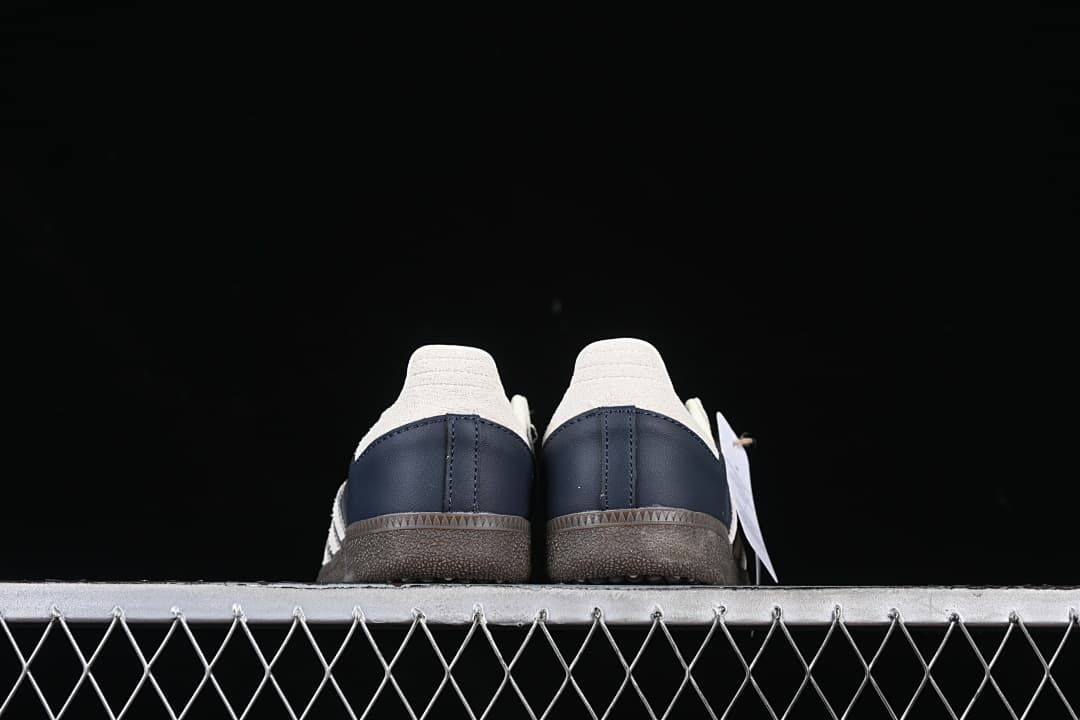 Rear view of the pair showing cream heel tabs and navy heel panels