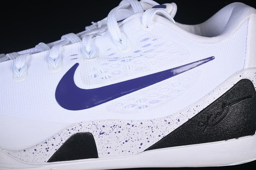 Close-up of the white upper, purple swoosh and black heel-side panel