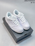 Pair of white Jordan Sixty Plus Low sneakers shown on a shoebox