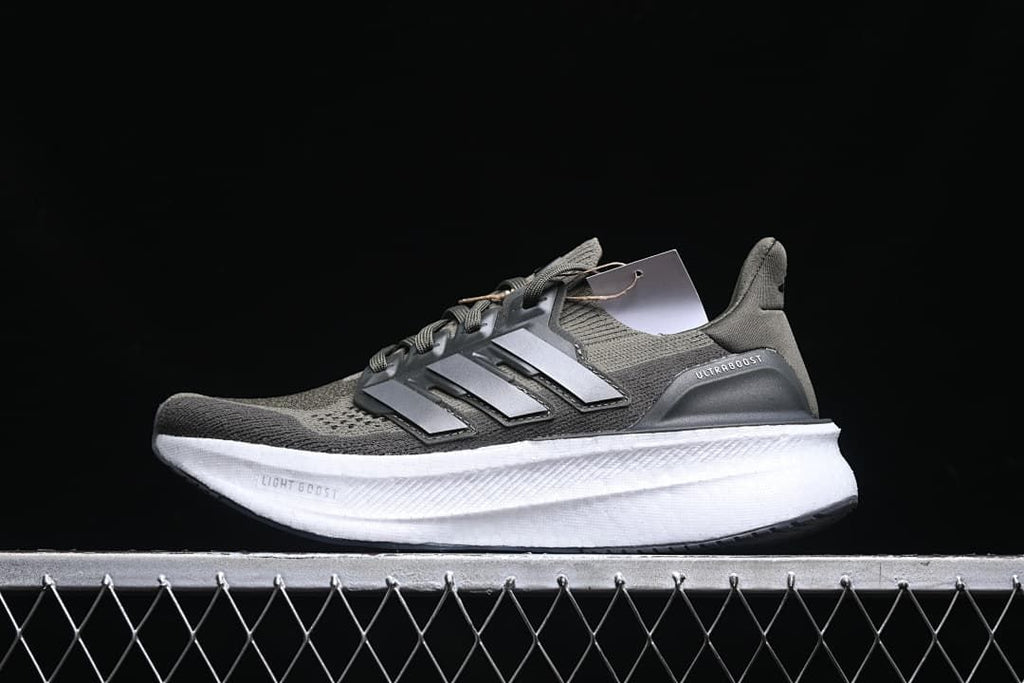 Side view of an olive adidas Ultraboost 5X running shoe with a white midsole