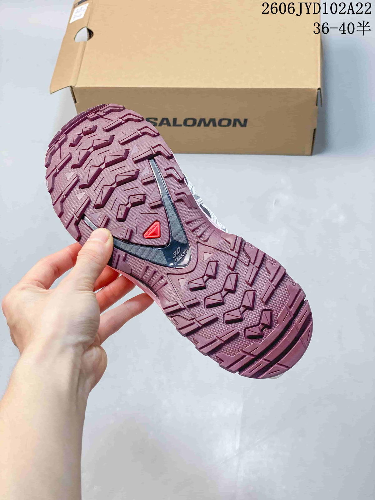 Close-up of the patterned pink outsole on a Salomon XA Pro 3D shoe