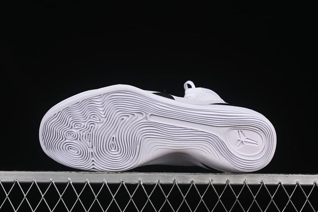 Underside view showing the white outsole traction pattern and Kobe logo