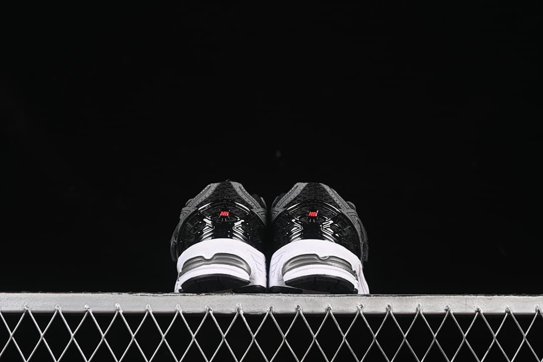 Rear view of the pair showing black heel details and white midsoles.