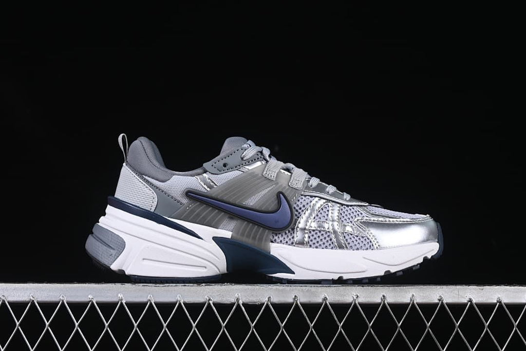 Side profile of the silver and gray Nike V2K Run sneaker