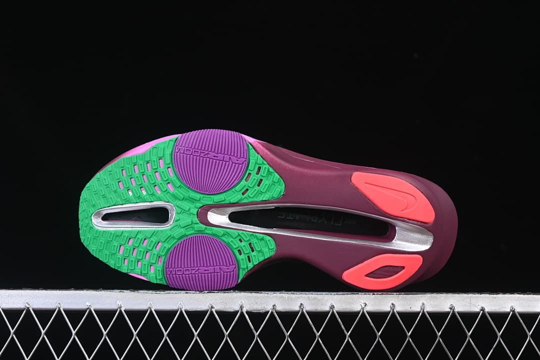 Underside view showing the shoe outsole and colored tread sections