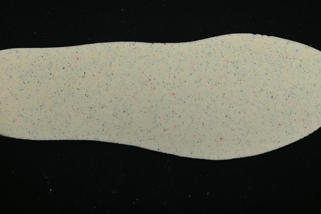 Light-colored insole shown against a dark background