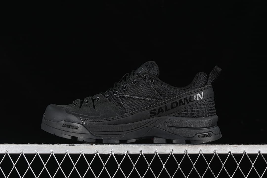 Black Salomon X-ALP MM6 sneaker shown in side profile
