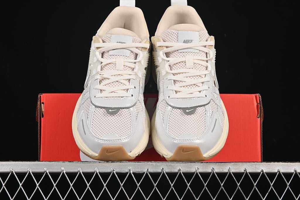 Front view of the pair showing mesh toes, laces, and gum-colored toe details