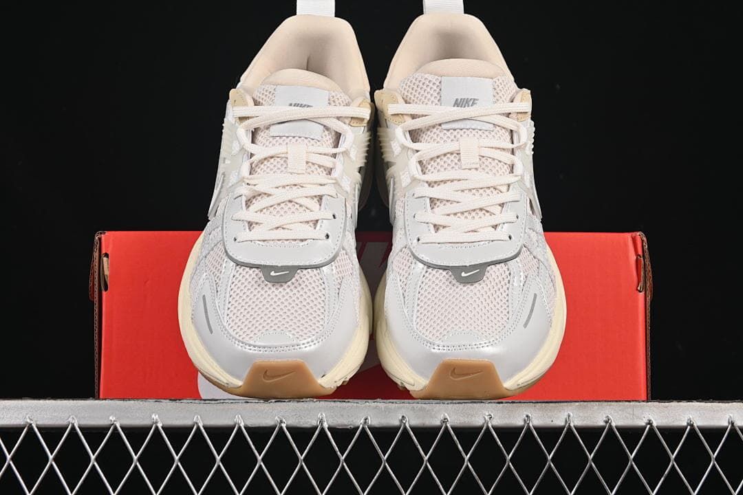 Front view of the pair showing mesh toes, laces, and gum-colored toe details
