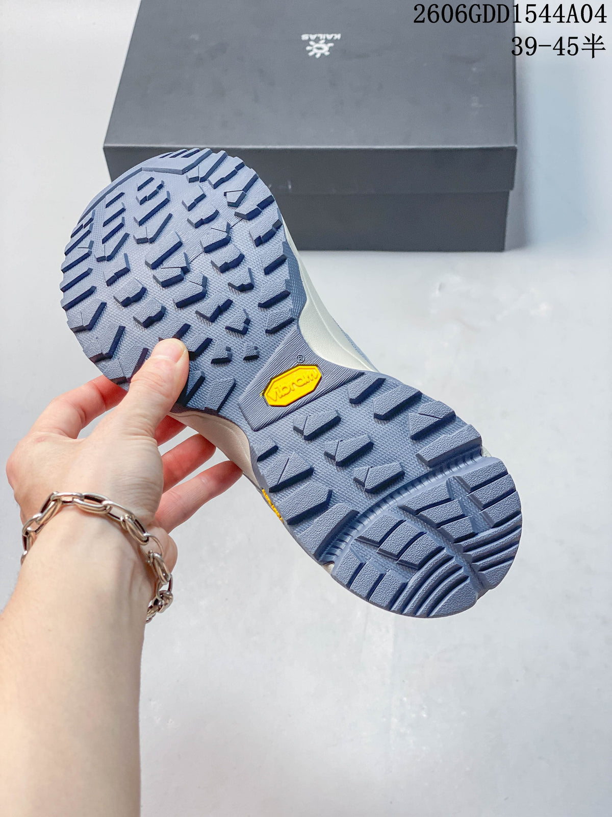 Close-up of the lugged hiking shoe outsole with a Vibram mark.