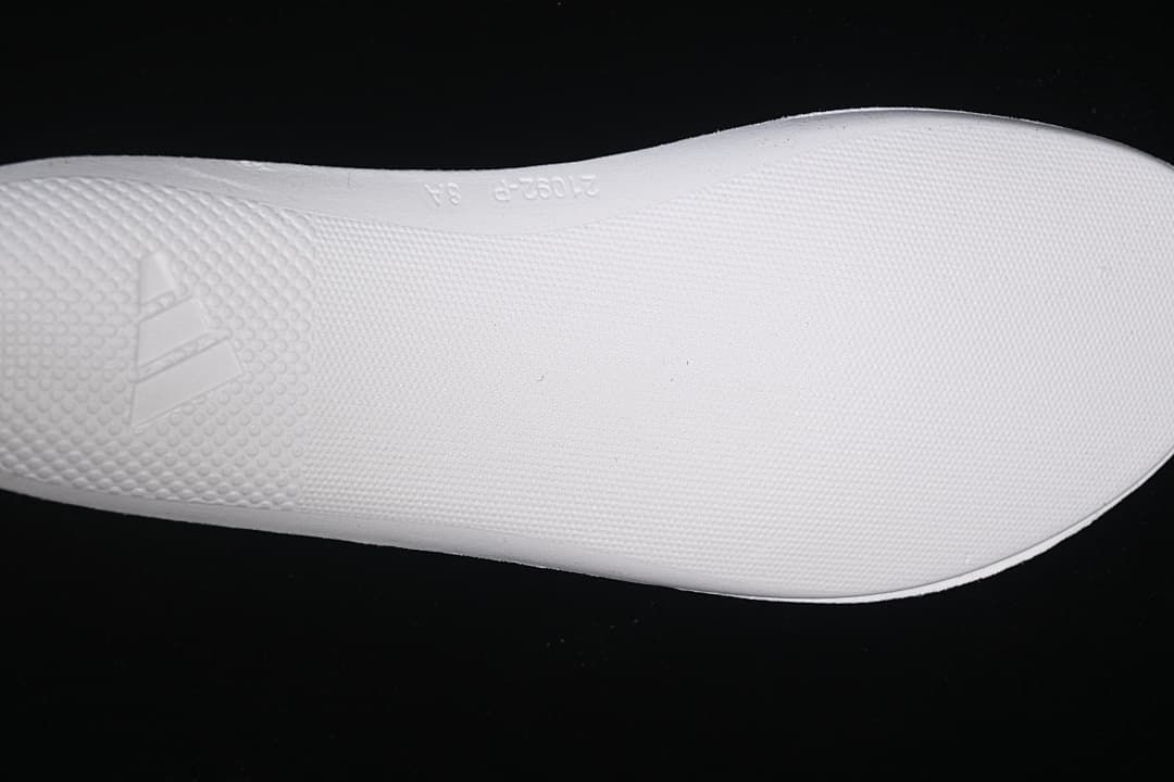 Close-up of the white outsole with adidas branding.