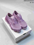 Pair of purple Nike VaporMax Flyknit sneakers on a shoebox; image displays the size range 36–40 and style code JGD242A22.