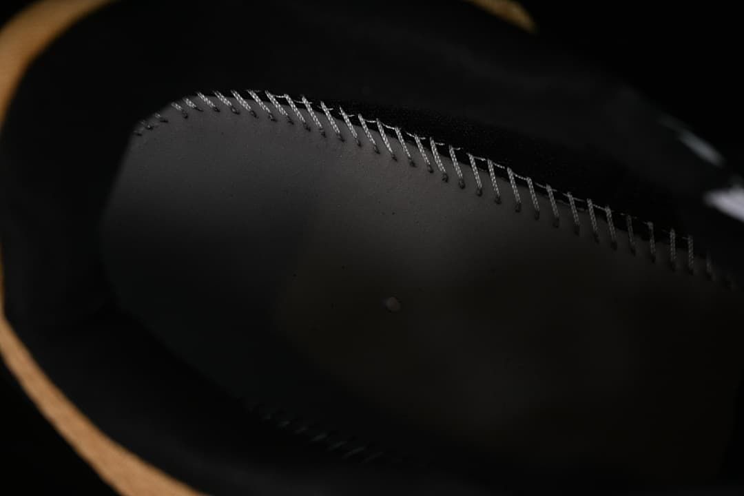 Close-up of the dark interior stitching inside the shoe