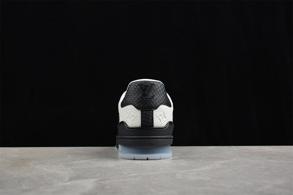 Rear view highlighting the black heel panel and pale translucent outsole.