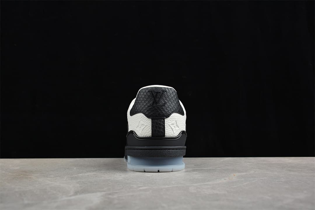 Rear view highlighting the black heel panel and pale translucent outsole.