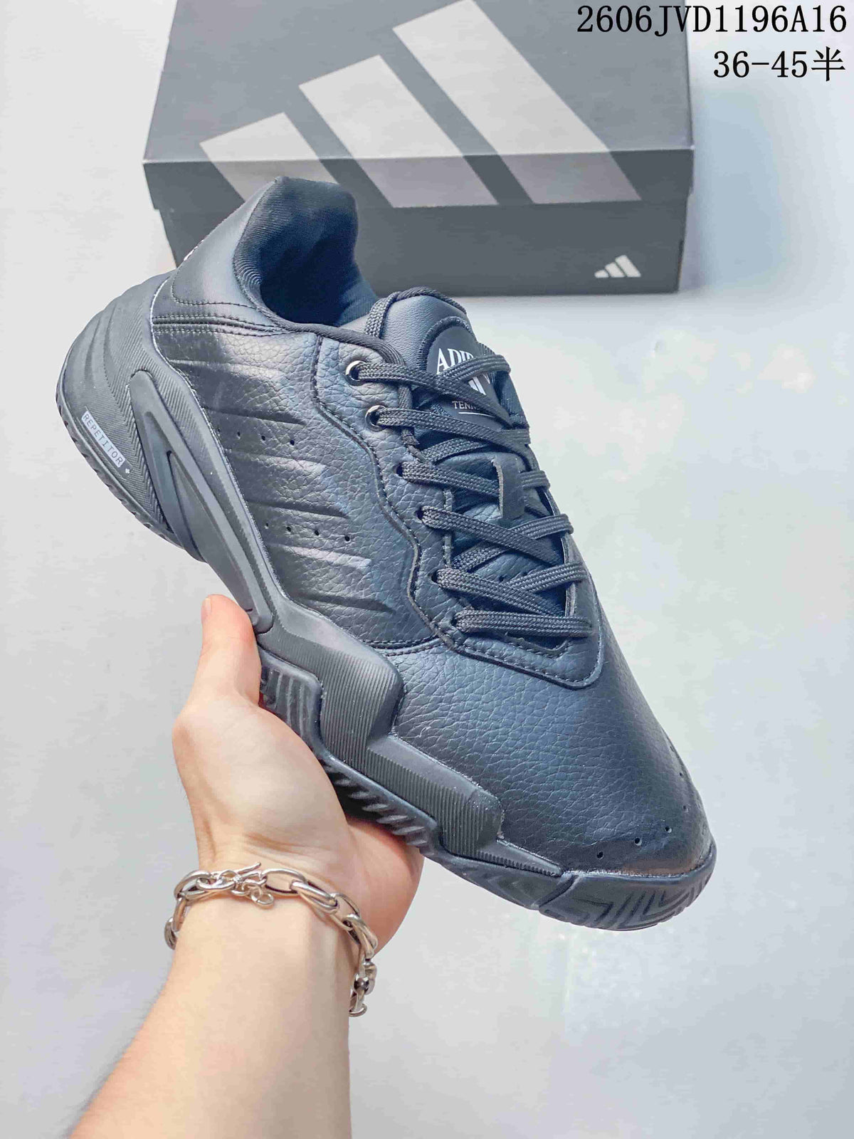 Angled side view of a dark grey Adidas tennis shoe