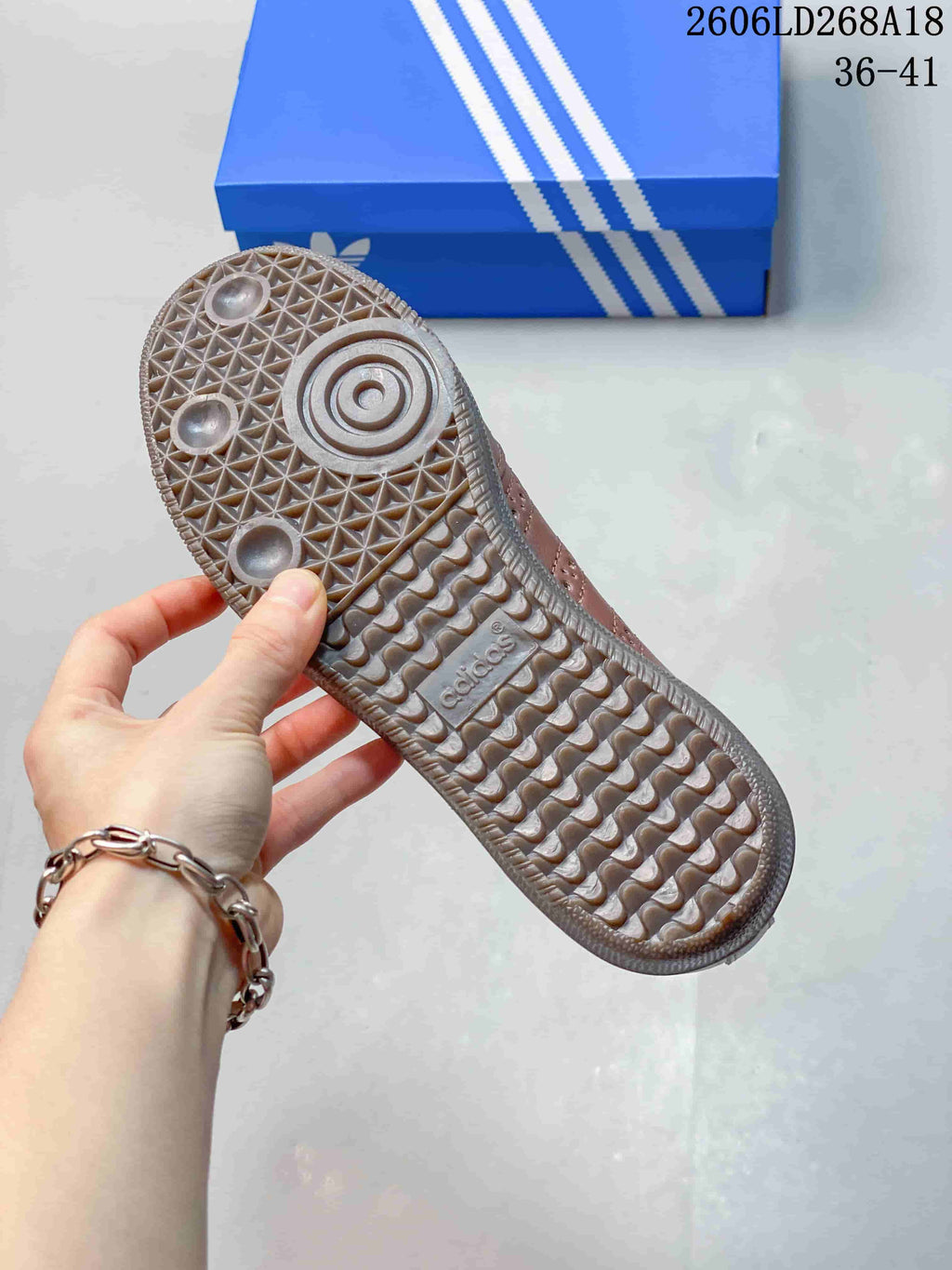 Close-up of the textured gum-colored outsole of a brown Samba Jane sneaker