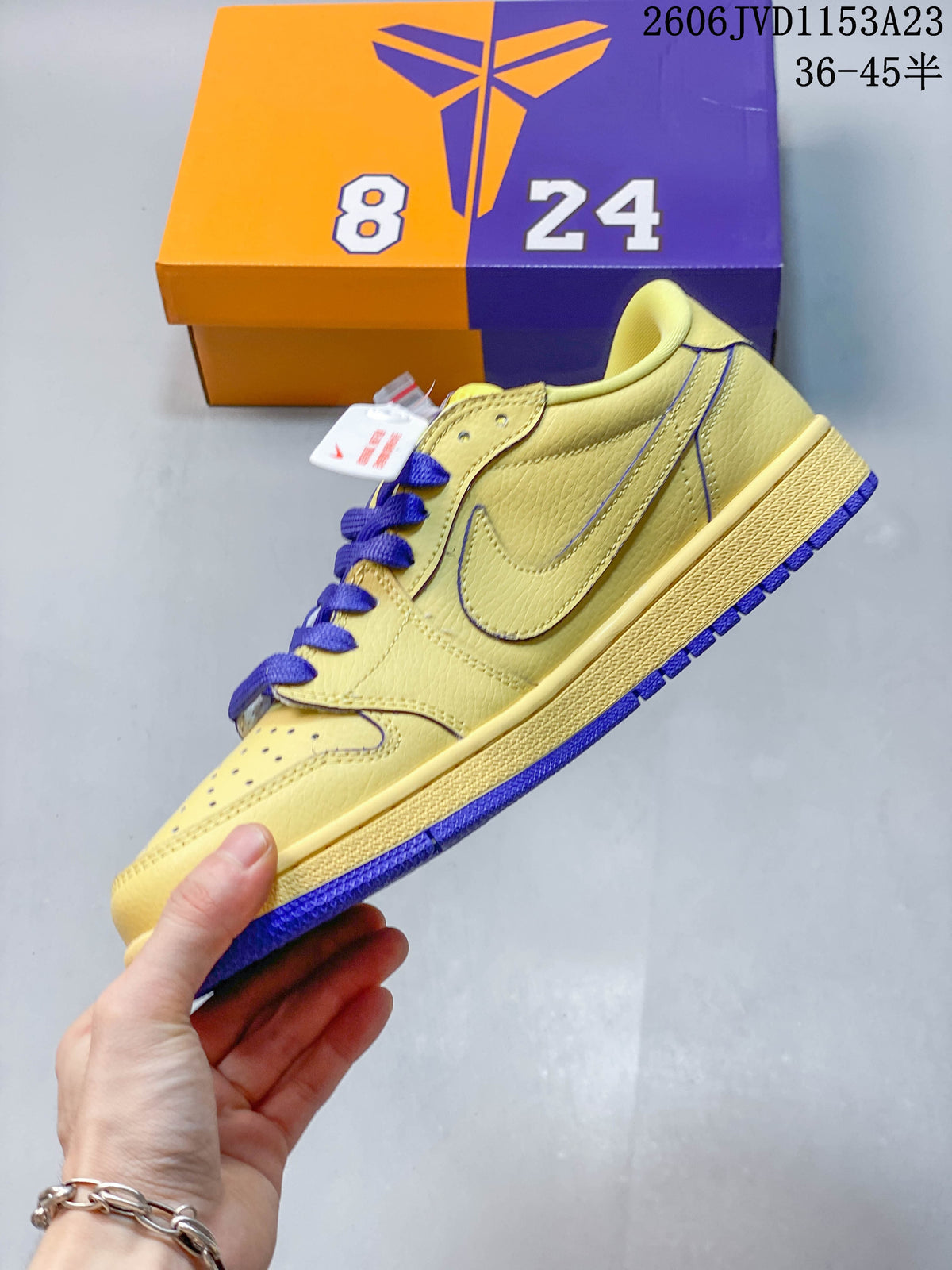 Side view of the yellow low-top sneaker with purple accents