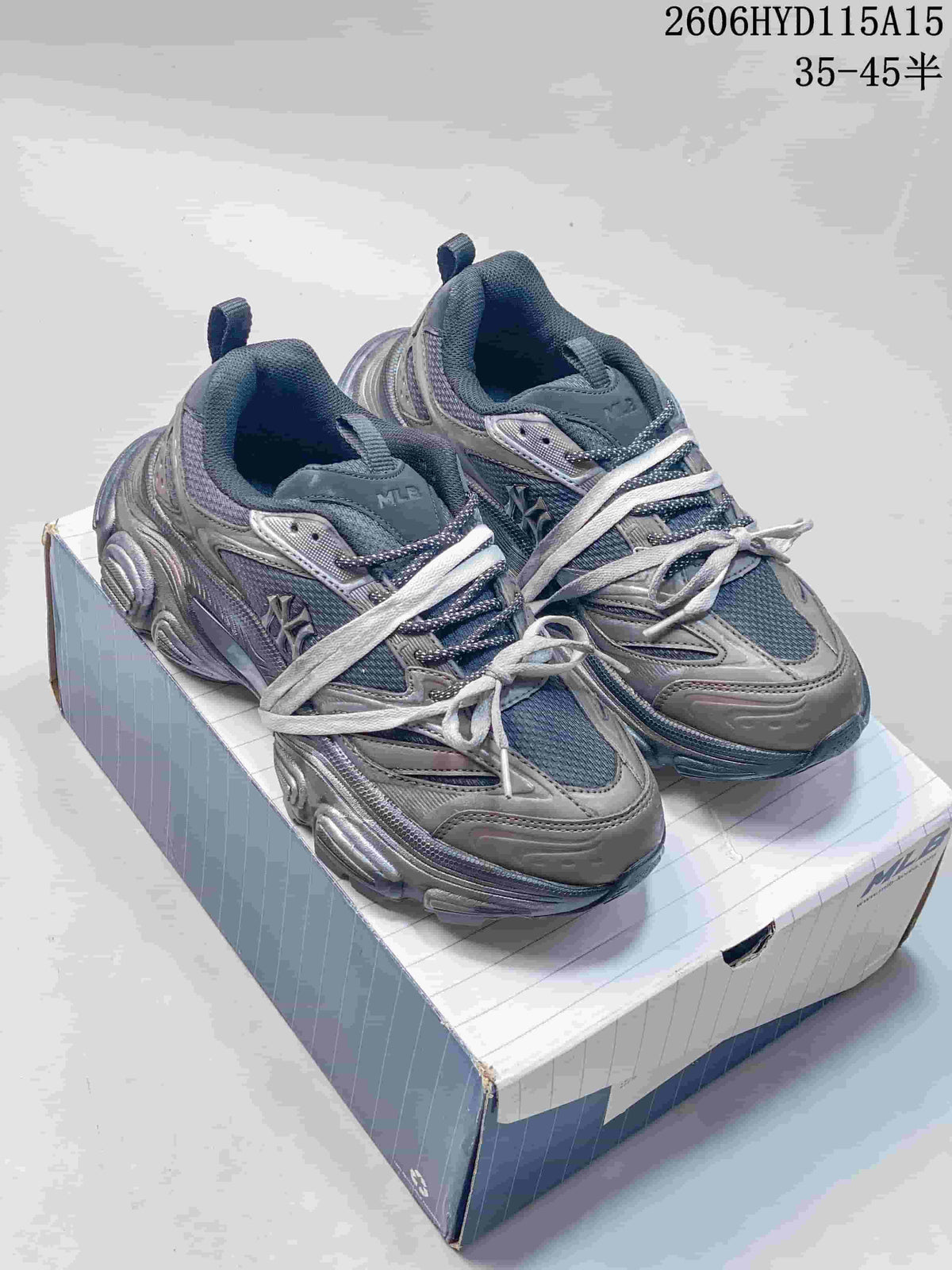 Pair of silver-gray MLB Winner Chunky low-top sneakers displayed on a shoebox