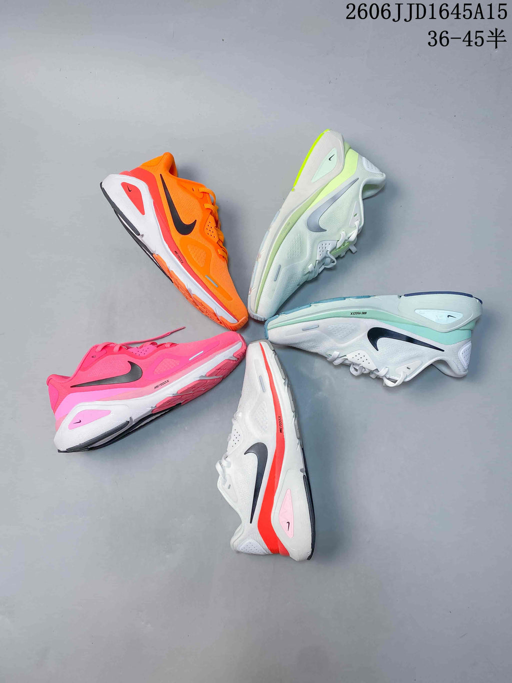 Five Nike Air Structure 26 running shoes displayed in orange, lime, mint, pink, and coral-accented colorways.