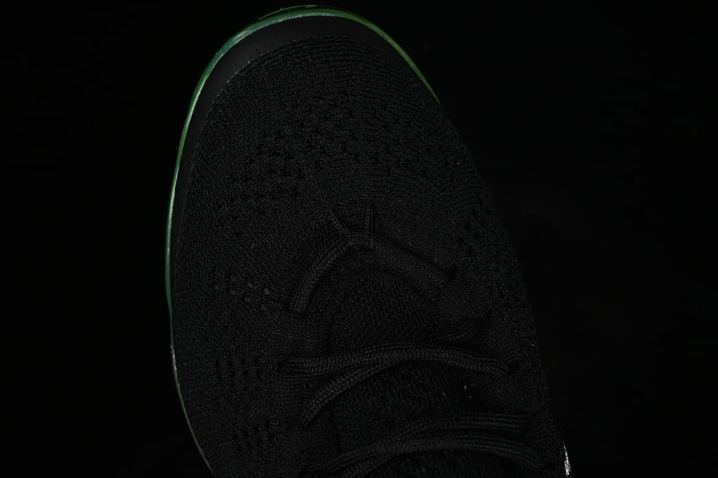 Top view of the black knit toe and lace-up front.