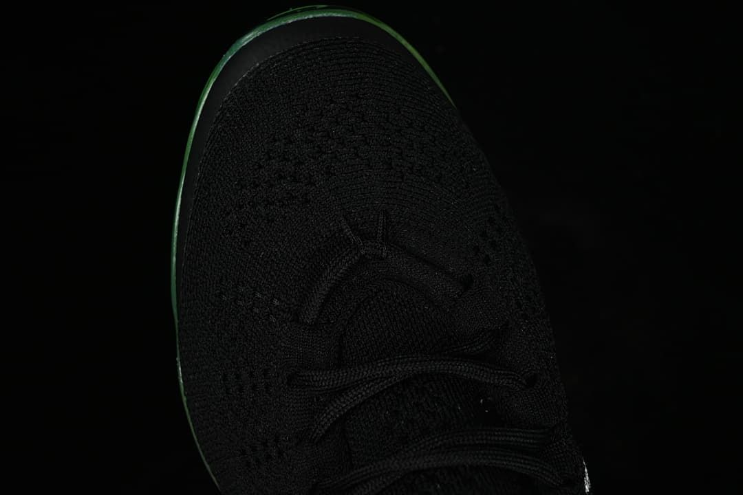 Top view of the black knit toe and lace-up front.