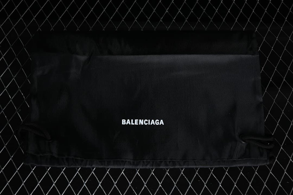 Black branded shoe dust bag shown against a dark background