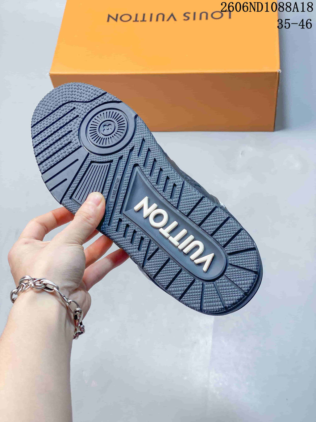 Close-up of the sneaker outsole showing its textured tread and raised lettering