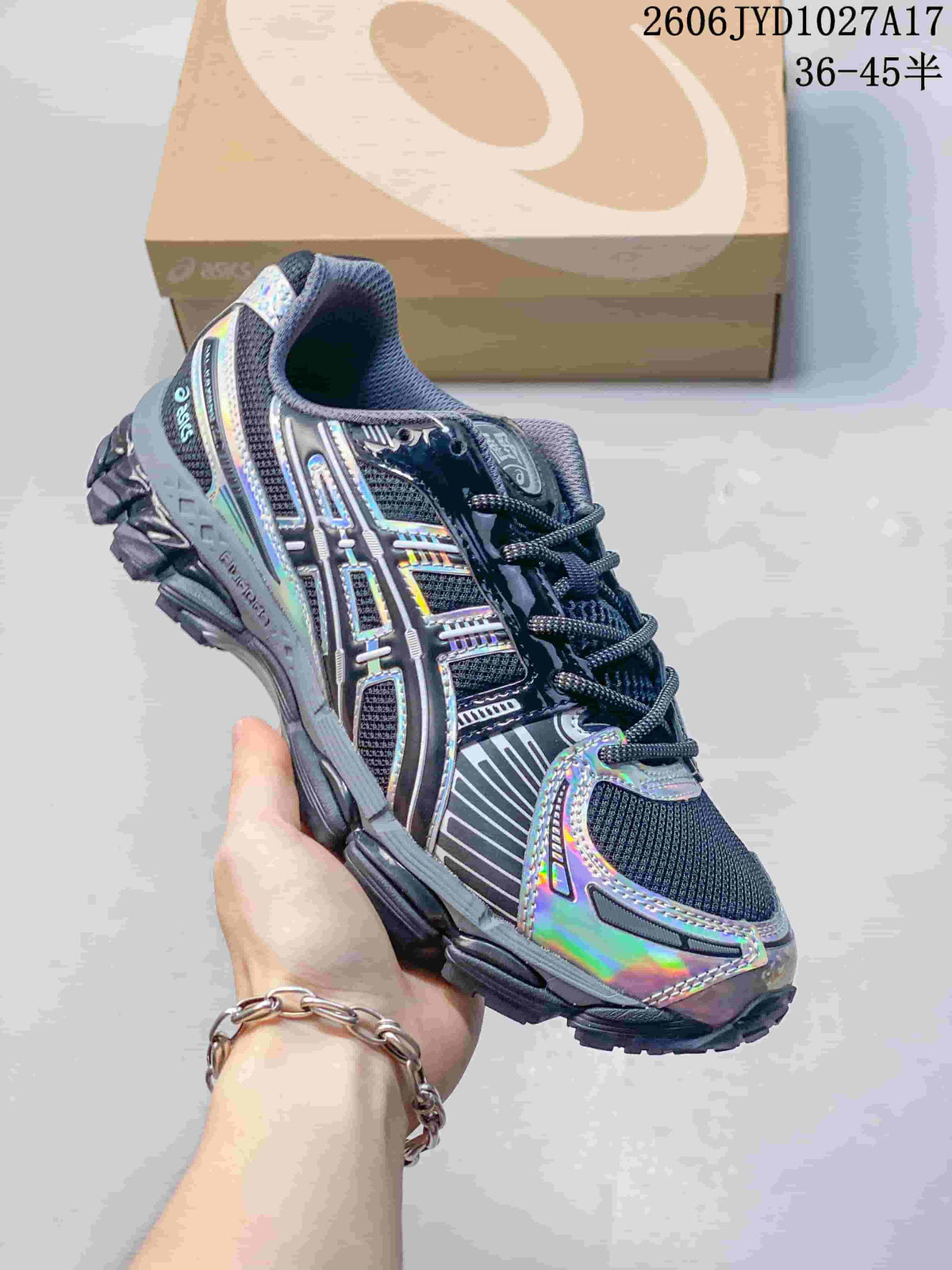 Silver ASICS GEL-KAYANO 12.1 sneaker with green accents