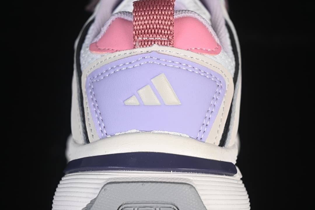 Close-up of the lavender heel panel, pink detail, and heel pull tab