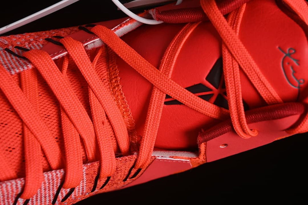 Close-up of the red laces and tongue details