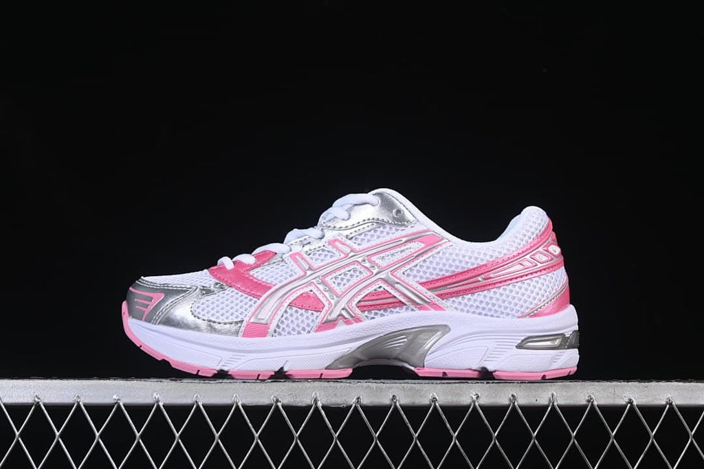 ASICS GEL-1130 sneaker in white, pink, and silver, shown from the side.