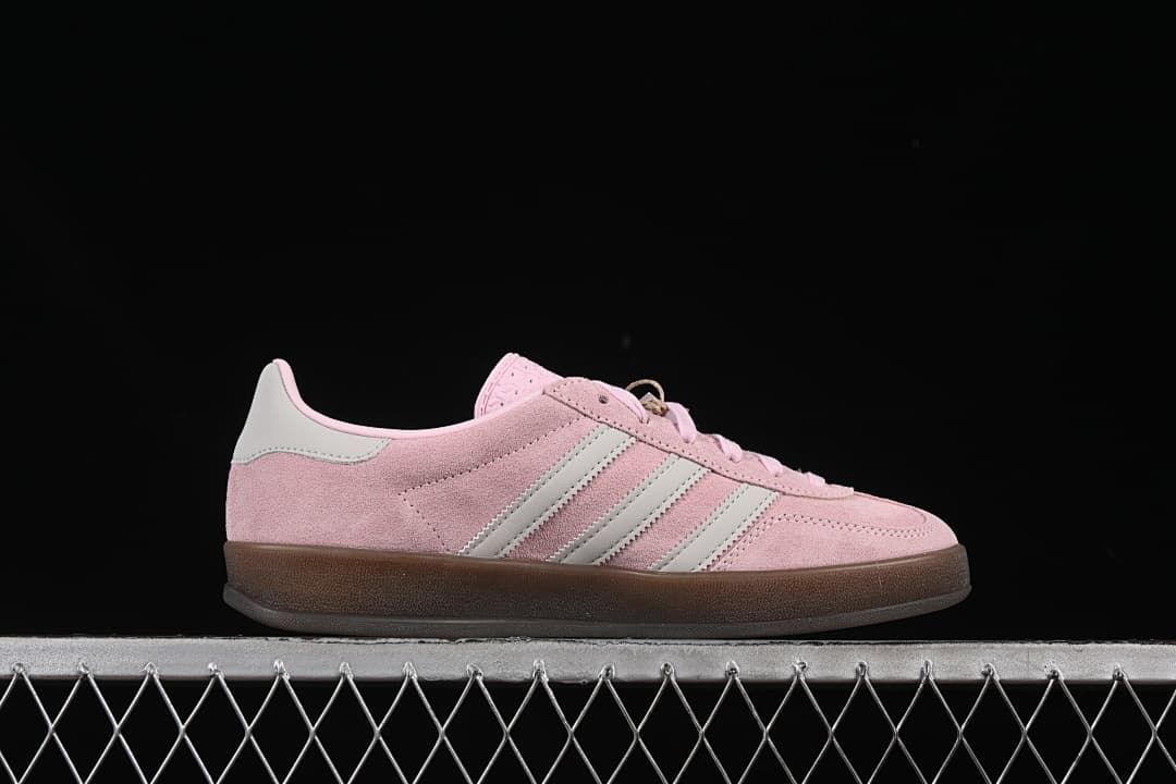 Side profile of a pink Gazelle Indoor sneaker