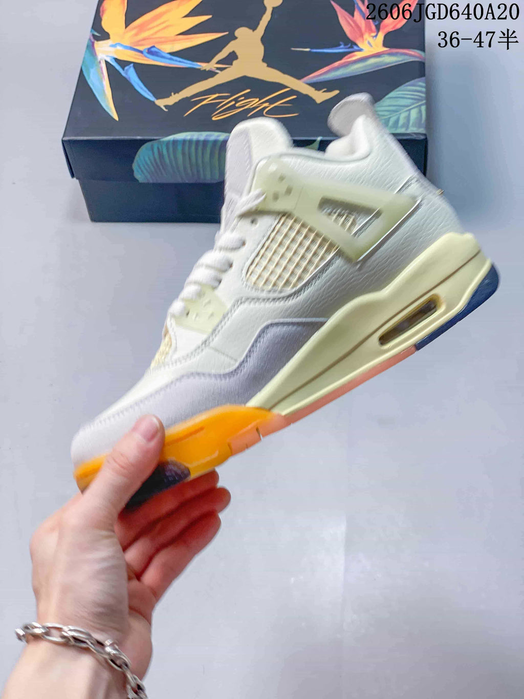 Side profile showing mesh panels, layered overlays, and the heel cushioning window