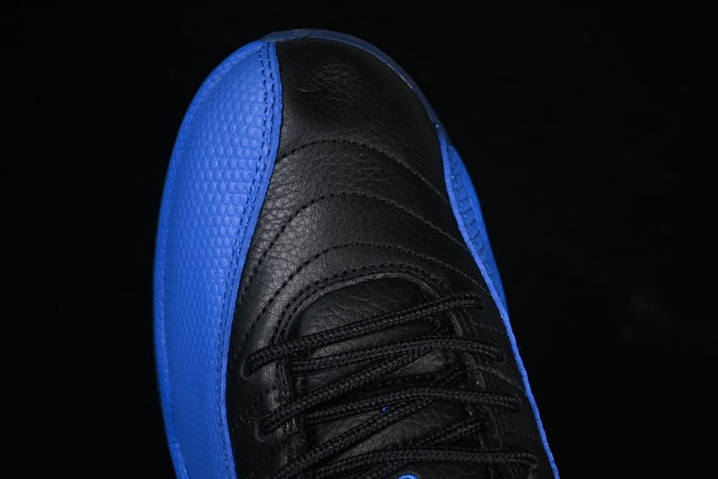 Top view of the black lacing and blue textured side panels