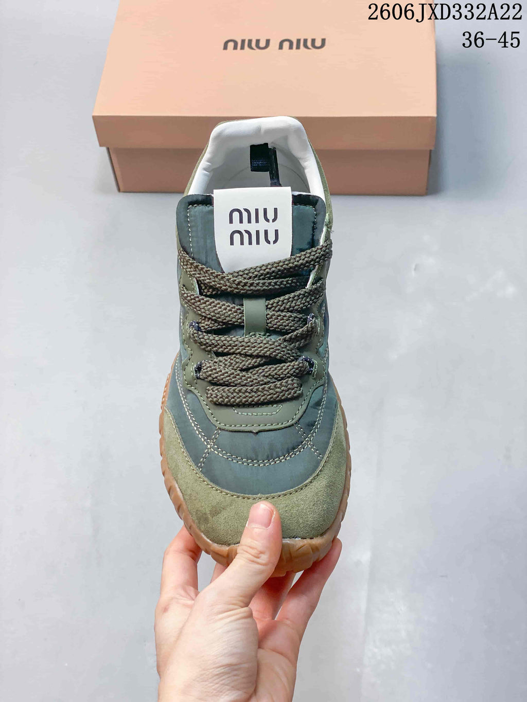 Front view of a Miu Miu Tyre sneaker with round toe and lace-up closure