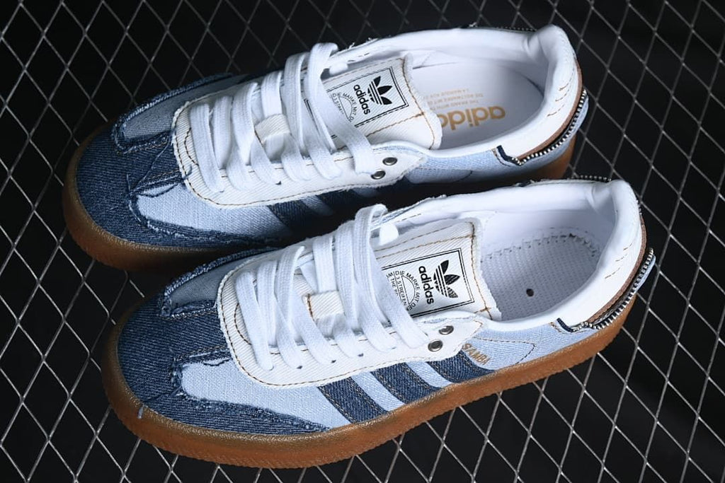 Pair of blue denim-look sneakers with white laces and gum-colored soles