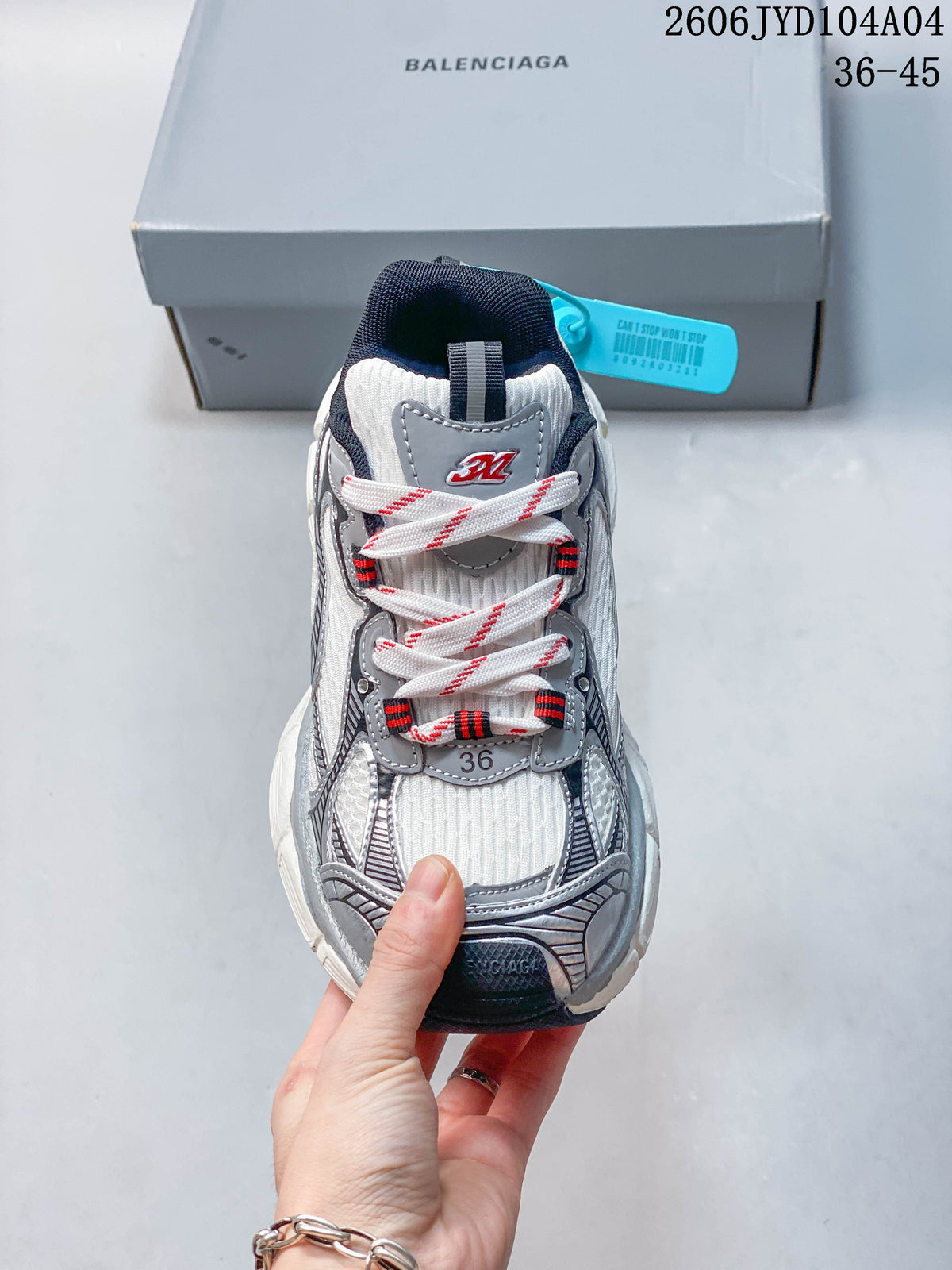 Front view showing patterned laces and layered toe details