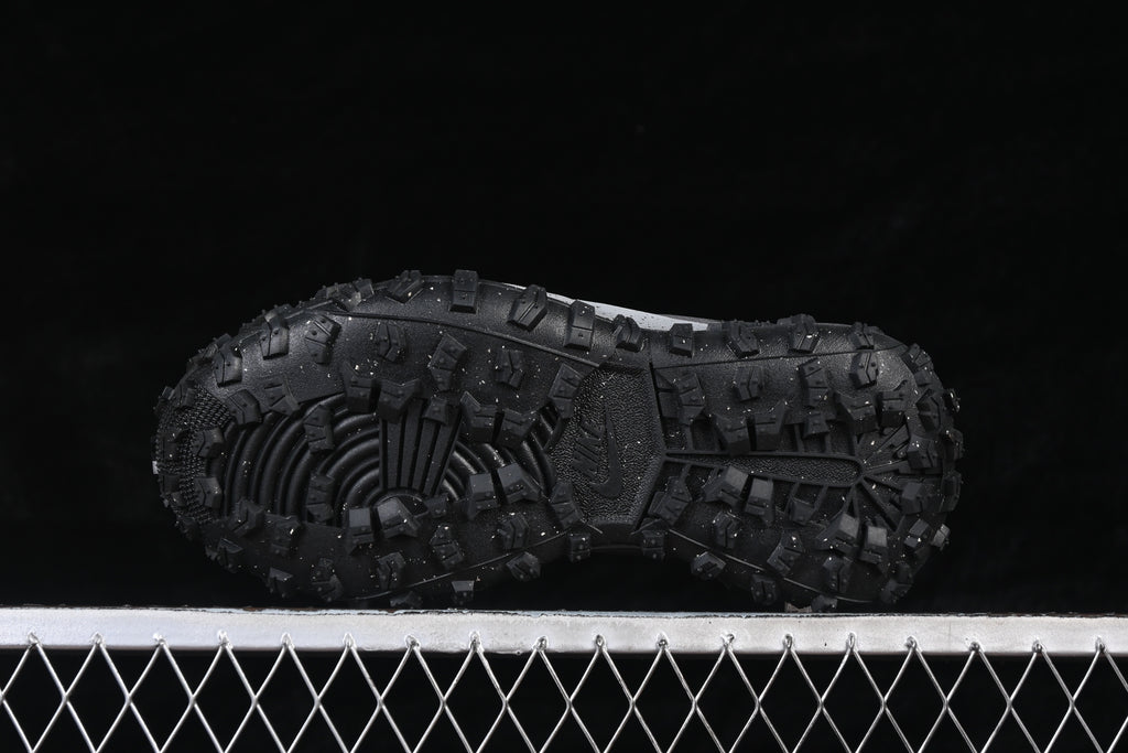 Underside view showing the sneaker's rugged, lugged outsole