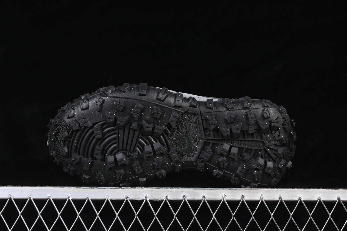 Underside view showing the sneaker's rugged, lugged outsole