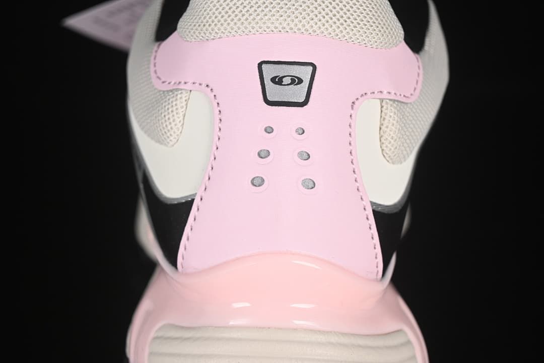 Rear close-up of the pink heel panel and light mesh collar